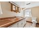Vintage bathroom with mosaic walls, tiled countertops, and dual sinks at 4 St Teresa Dr, Charleston, SC 29407