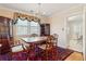 Formal dining room with traditional furnishings, including a wooden table and chairs, elegant drapery, and a chandelier at 4 St Teresa Dr, Charleston, SC 29407