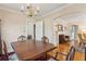 Traditional dining room featuring hardwood floors, a wooden dining table, and a decorative chandelier at 4 St Teresa Dr, Charleston, SC 29407