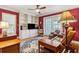 Living room featuring built-in shelving, a ceiling fan, and french doors to the backyard at 4 St Teresa Dr, Charleston, SC 29407