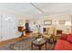 Bright and inviting living room with hardwood floors and classic furnishings with a view into the dining room at 4 St Teresa Dr, Charleston, SC 29407