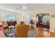 Spacious living room showcasing hardwood floors, elegant furnishings, and a seamless transition to the dining area at 4 St Teresa Dr, Charleston, SC 29407