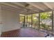 Bright screened-in porch perfect for enjoying fresh air with beautiful views of lush foliage at 4 St Teresa Dr, Charleston, SC 29407