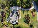 An impressive aerial view showing the home's layout, long driveway, and landscaping at 4086 Lady Banks Ln, Ravenel, SC 29470