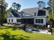 Expansive backyard with a fenced-in pool, patio area and mature trees for shade at 4086 Lady Banks Ln, Ravenel, SC 29470