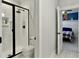 Bright bathroom featuring a walk-in shower with black trim and black fixtures at 4086 Lady Banks Ln, Ravenel, SC 29470