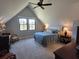 Comfortable bedroom featuring a queen-sized bed and an exterior view window at 4086 Lady Banks Ln, Ravenel, SC 29470