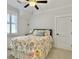 Bright bedroom featuring carpet floors, ceiling fan and white trim at 4086 Lady Banks Ln, Ravenel, SC 29470