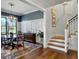 Beautiful dining area featuring elegant table set, chandelier, and staircase view at 4086 Lady Banks Ln, Ravenel, SC 29470