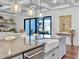 Gourmet kitchen with a center island, stainless steel appliances, and an undermount farmhouse style sink at 4086 Lady Banks Ln, Ravenel, SC 29470