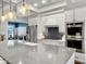 Bright kitchen featuring a spacious island, stainless steel appliances, modern lighting, and designer finishes at 4086 Lady Banks Ln, Ravenel, SC 29470