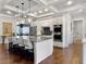 Modern kitchen featuring a large island, stainless steel appliances, and stylish pendant lighting at 4086 Lady Banks Ln, Ravenel, SC 29470