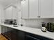 Well-lit kitchen featuring white cabinets and quartz countertops and stainless steel appliances at 4086 Lady Banks Ln, Ravenel, SC 29470