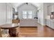 Spacious living area with vaulted ceilings, a cozy seating area, and hardwood floors at 4086 Lady Banks Ln, Ravenel, SC 29470