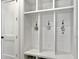 Organized mudroom area featuring built-in shelving with hooks and cubbies and decor at 4086 Lady Banks Ln, Ravenel, SC 29470