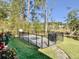 Fenced in pool area with manicured lawn and view of the marsh at 4086 Lady Banks Ln, Ravenel, SC 29470