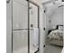 Modern shower with glass enclosure and view into the bedroom at 4086 Lady Banks Ln, Ravenel, SC 29470