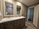 Bathroom featuring double sinks, shower, and vinyl floors at 4532 S Carolina # 41, Huger, SC 29450