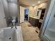 Full bathroom featuring double sink vanity with soaking tub at 4532 S Carolina # 41, Huger, SC 29450