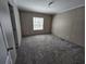The empty bedroom features plush carpeting and natural light at 4532 S Carolina # 41, Huger, SC 29450