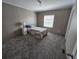 Cozy bedroom features plush carpeting, natural light, and neutral walls at 4532 S Carolina # 41, Huger, SC 29450