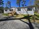 Beautiful single story home with a new front porch, well-manicured lawn, and gravel driveway at 4532 S Carolina # 41, Huger, SC 29450