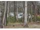 View of home partially obscured by trees and foliage at 4532 S Carolina # 41, Huger, SC 29450