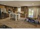 Eat-in kitchen featuring wood cabinets, an island with bar stool seating, and stainless steel appliances at 4532 S Carolina # 41, Huger, SC 29450