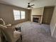 Living room featuring a stone fireplace, plush carpeting and neutral color palette at 4532 S Carolina # 41, Huger, SC 29450