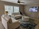 Comfortable living room area with bright windows, a plush couch, and contemporary décor at 4532 S Carolina # 41, Huger, SC 29450