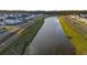 Beautiful aerial view of the community lined with sidewalks along a peaceful pond at 460 Cool Bend Ln, Summerville, SC 29486