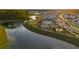 An aerial view showcases community tennis courts and a river at 460 Cool Bend Ln, Summerville, SC 29486