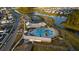 Aerial view showcases community amenities: a pool, clubhouse, tennis courts, and scenic waterways at 460 Cool Bend Ln, Summerville, SC 29486