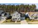 Aerial view of a gray two story home with manicured lawn and two-car garage at 460 Cool Bend Ln, Summerville, SC 29486