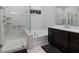 Modern bathroom with glass enclosed shower, soaking tub, and double sink vanity at 460 Cool Bend Ln, Summerville, SC 29486