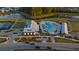 Aerial view of a community pool with lounge chairs, surrounded by trees at 460 Cool Bend Ln, Summerville, SC 29486