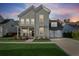 Beautiful two story home featuring gray siding, well manicured lawn, and a two car garage at 460 Cool Bend Ln, Summerville, SC 29486