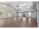 Spacious room with light wood floors, a high ceiling with a fan, and large windows at 460 Cool Bend Ln, Summerville, SC 29486