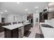 Spacious kitchen featuring a large island, stainless steel appliances, and dark wood cabinets at 460 Cool Bend Ln, Summerville, SC 29486