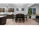 Open concept kitchen featuring wooden floors, cabinets, and a dining table at 460 Cool Bend Ln, Summerville, SC 29486