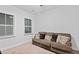 Neutral colored living room featuring a comfortable sofa, pillows, and bright windows at 460 Cool Bend Ln, Summerville, SC 29486