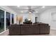 Spacious living room with gray sectional, ceiling fan, and sliding glass doors at 460 Cool Bend Ln, Summerville, SC 29486
