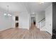 Bright living room with hardwood floors, staircase, and sight lines into other rooms of the home at 460 Cool Bend Ln, Summerville, SC 29486