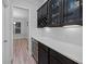 Wet bar with a wine rack, refrigerator, and white countertops at 460 Cool Bend Ln, Summerville, SC 29486