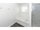 Bathroom with a corner tub and a glass-enclosed shower for a spa-like experience at 4809 Bushel Rd, Ladson, SC 29456