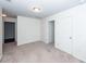 This bedroom has carpeted floors and white walls with doors leading to the hallway and closet at 4809 Bushel Rd, Ladson, SC 29456