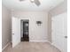 Neutral bedroom featuring beige carpet and white doors and a TV mount at 4809 Bushel Rd, Ladson, SC 29456