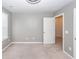 Neutral bedroom with carpeted floors, a window for natural light, and a closet with a view at 4809 Bushel Rd, Ladson, SC 29456