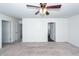 Spacious bedroom with plush carpet, ample natural light, and a ceiling fan at 4809 Bushel Rd, Ladson, SC 29456