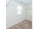 Walk-in closet features neutral carpet, a window, and wire shelving at 4809 Bushel Rd, Ladson, SC 29456